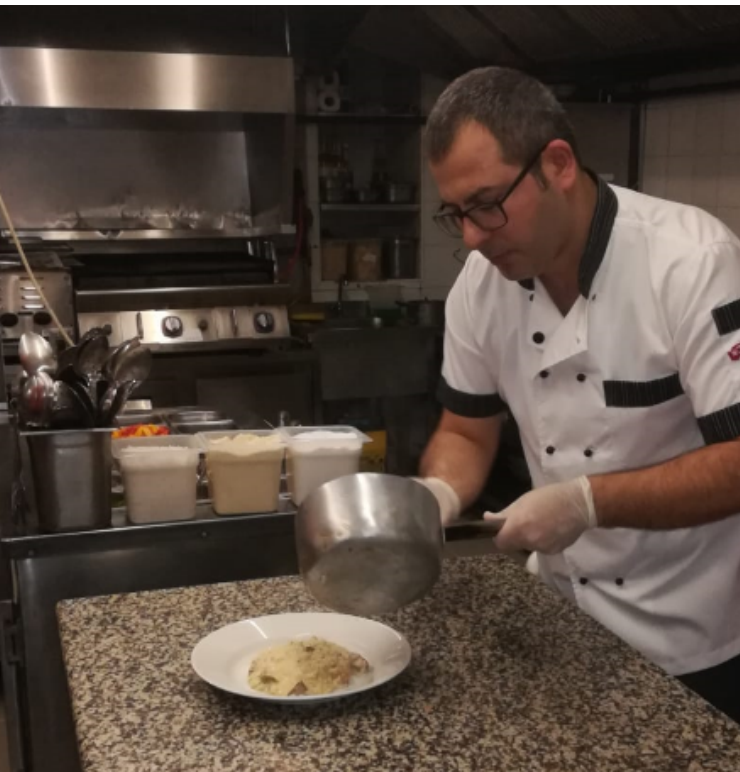 Chef Ramazan Vural pouring sauce